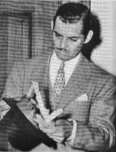 Playful reporters fill Clark's hat with papers while he testified